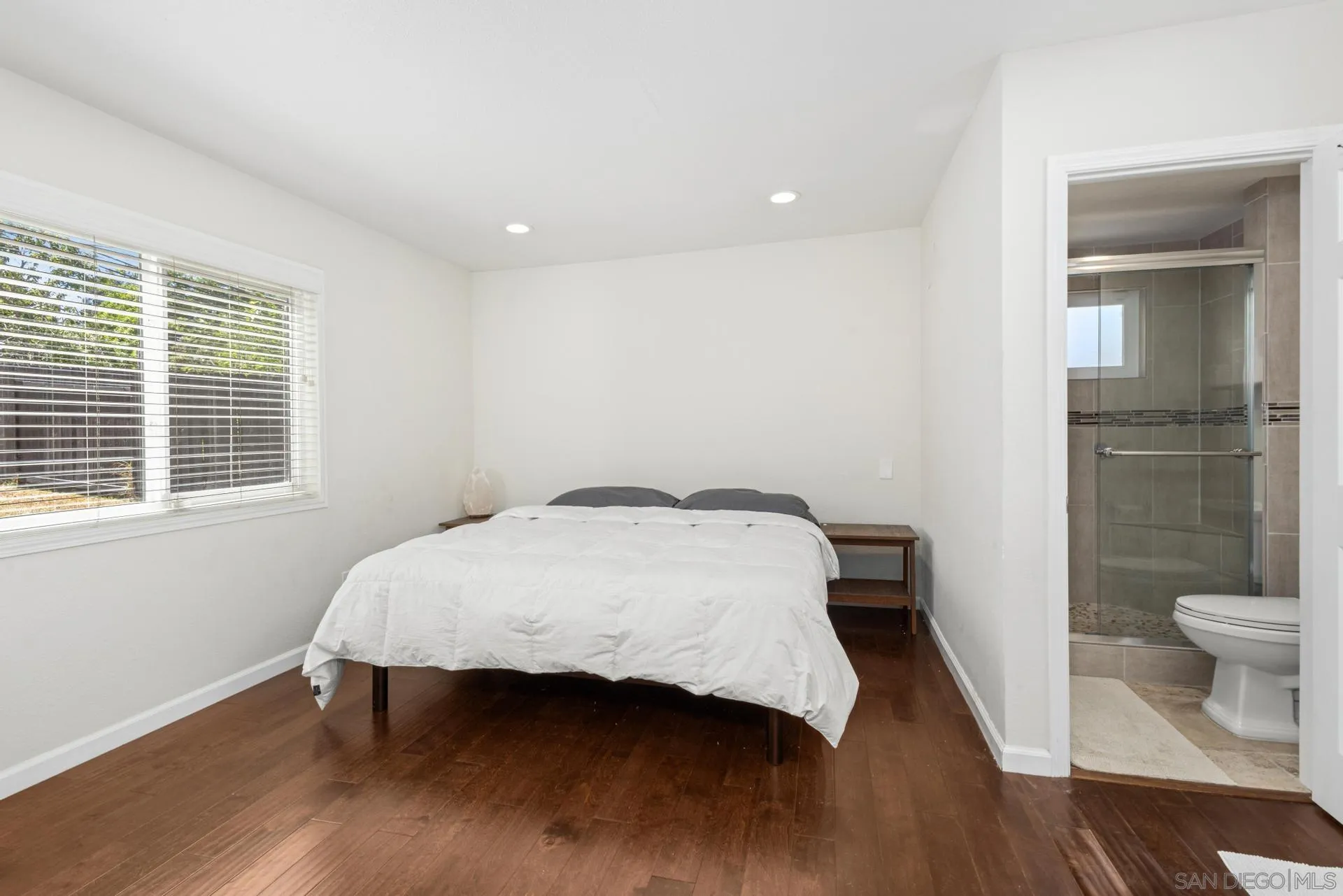 346 El Monte Road El Cajon, CA 92020 - Photo 14 of 24 a bedroom with a bed and a table