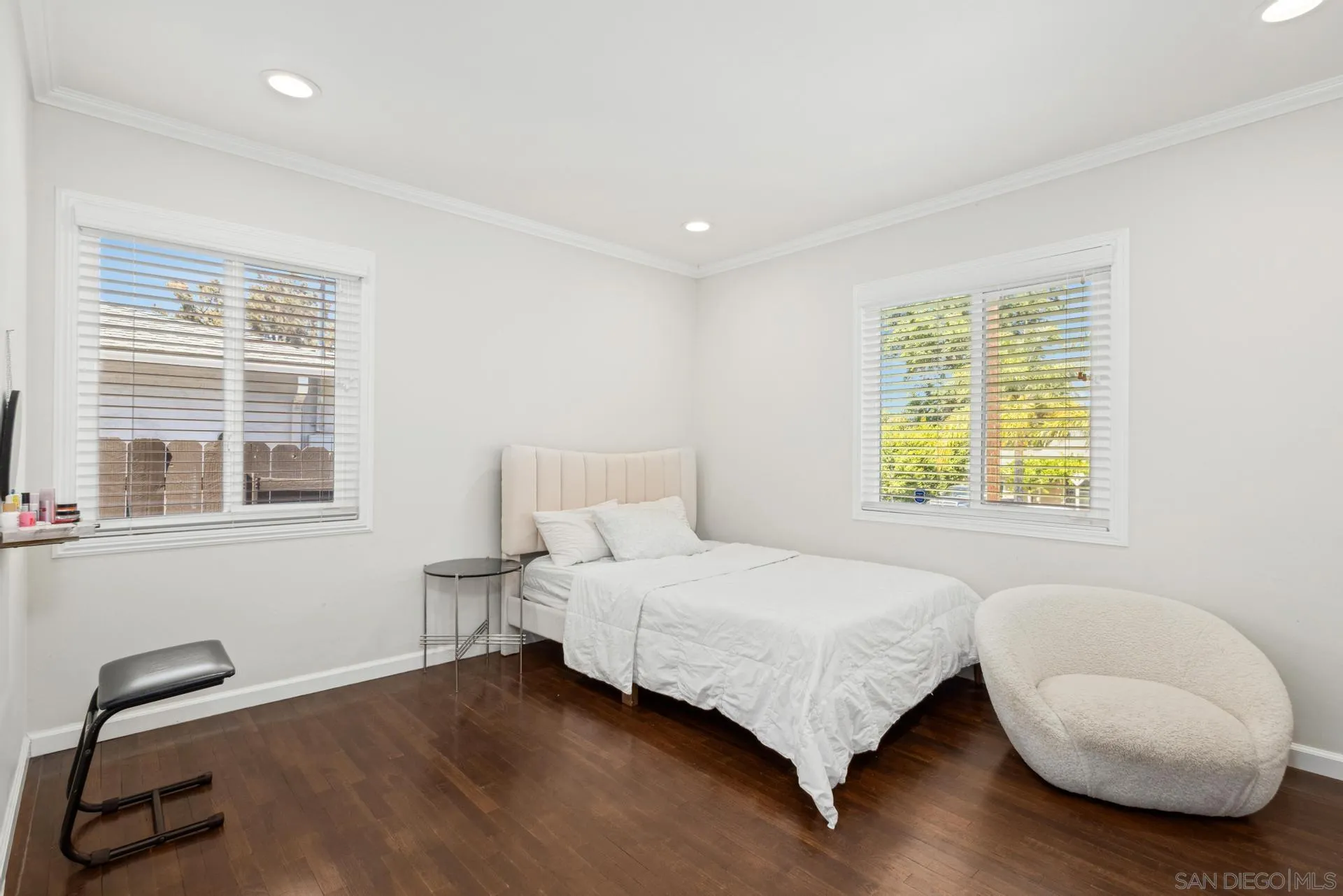 346 El Monte Road El Cajon, CA 92020 - Photo 18 of 24 a bedroom with a bed and a chair