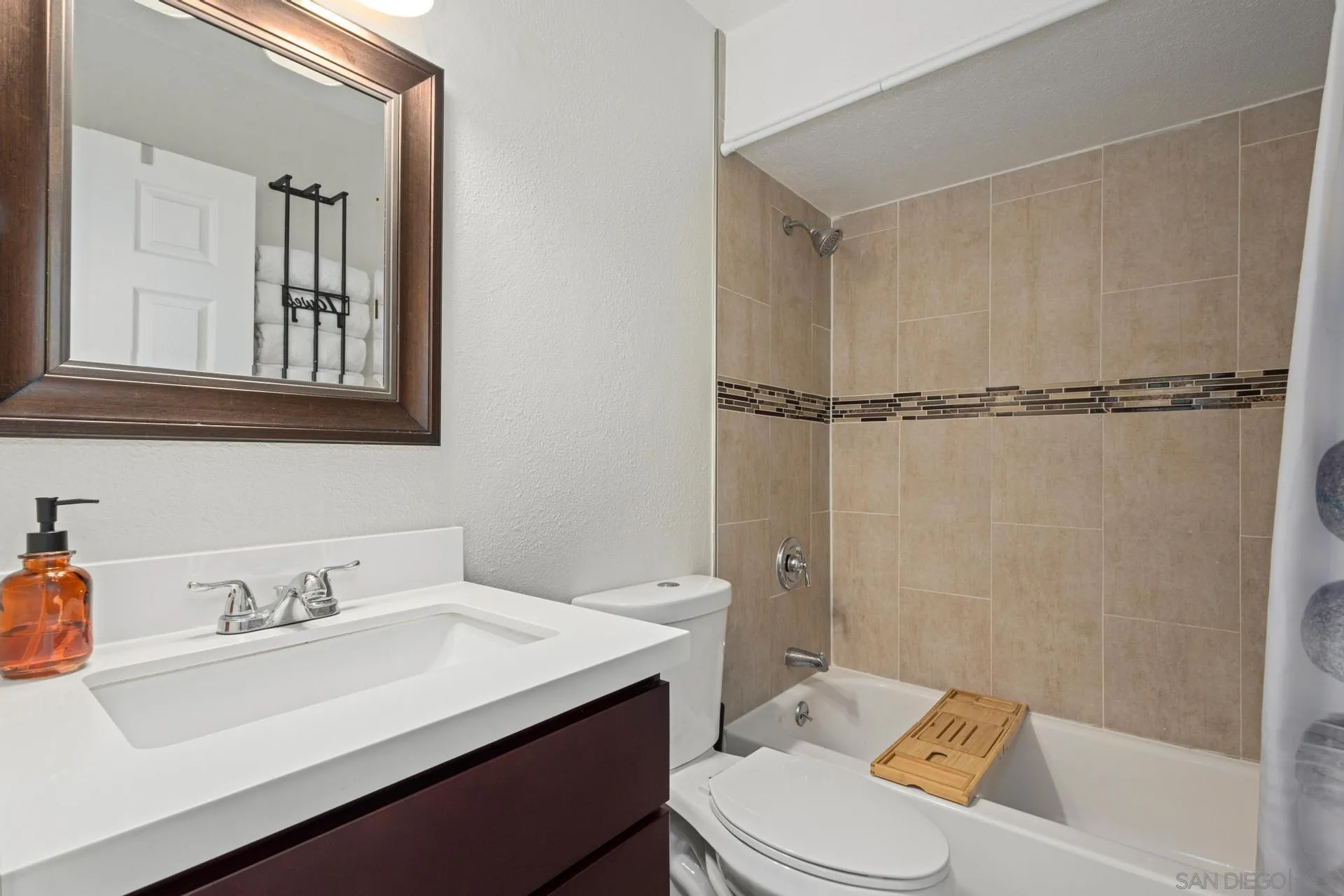 346 El Monte Road El Cajon, CA 92020 - Photo 19 of 24 a bathroom with a sink toilet vanity and shower