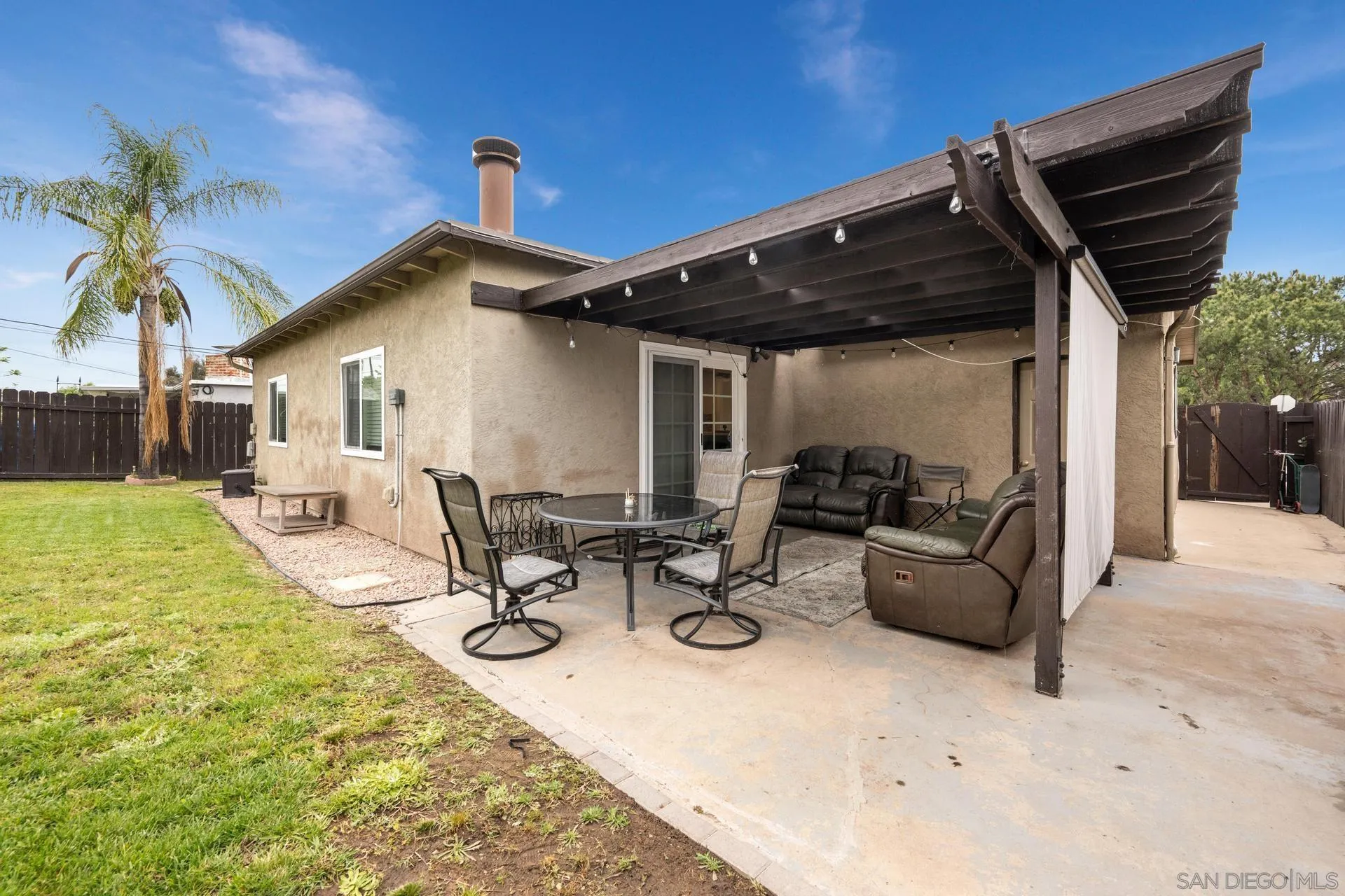 346 El Monte Road El Cajon, CA 92020 - Photo 21 of 24 a view of a patio with a table and chairs and potted plants