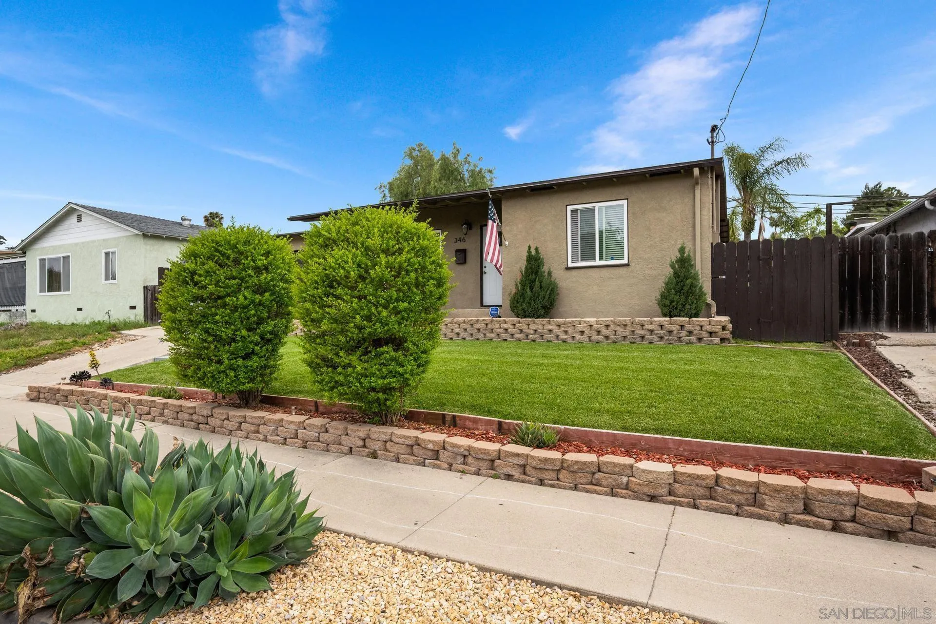 346 El Monte Road El Cajon, CA 92020 - Photo 24 of 24 a front view of a house with a yard and garage