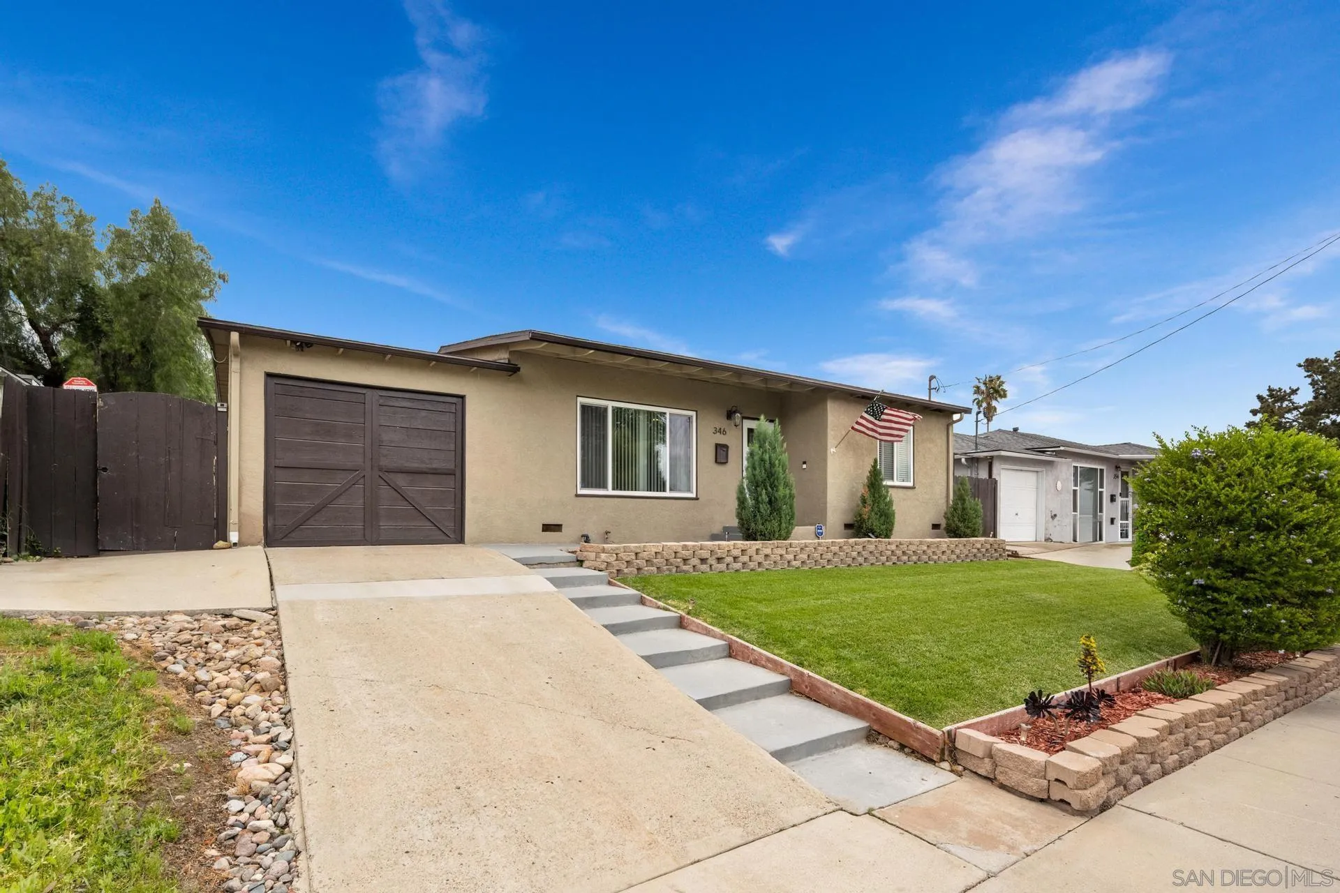 346 El Monte Road El Cajon, CA 92020 - Photo 4 of 24 a front view of a house with a yard