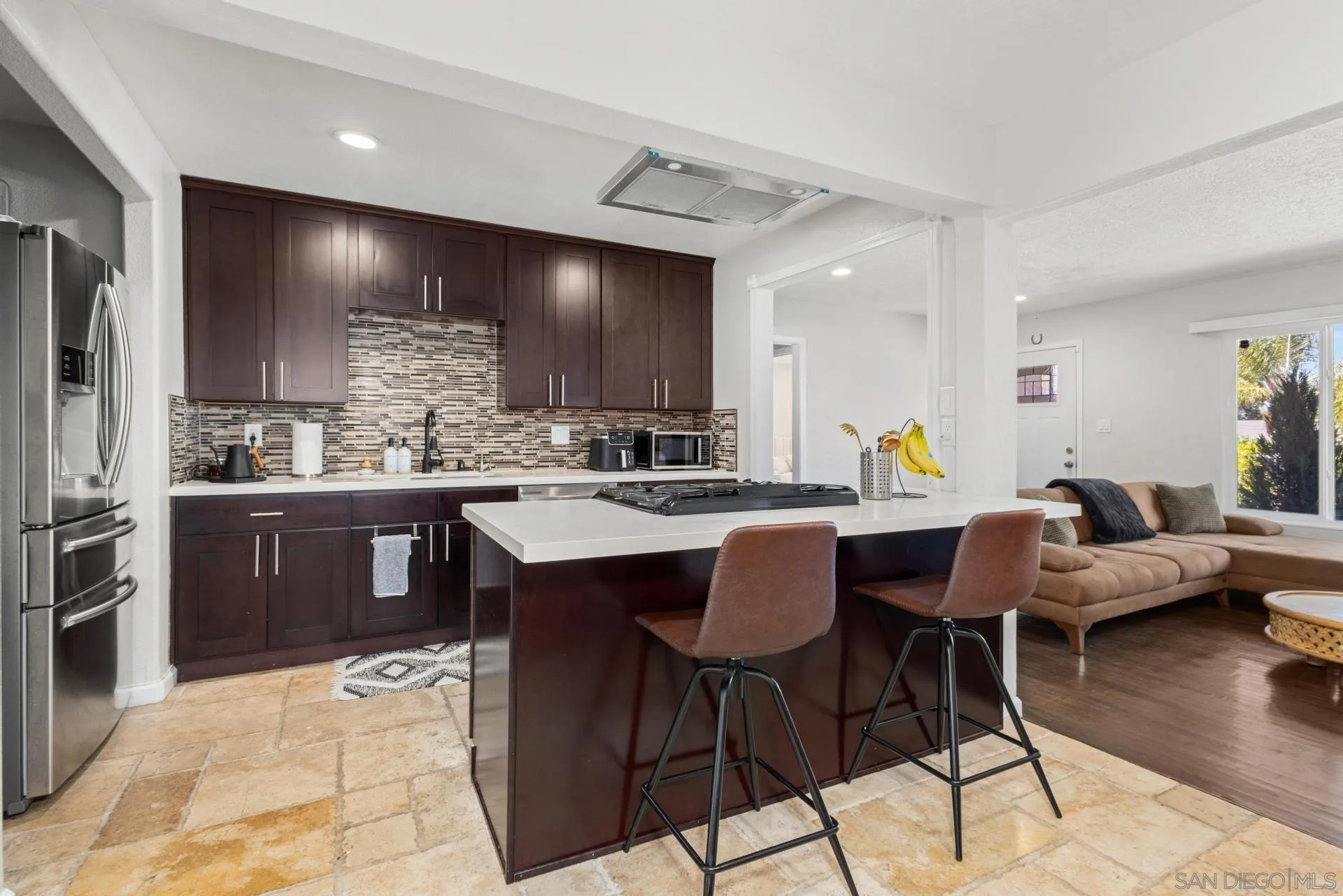 346 El Monte Road El Cajon, CA 92020 - Photo 5 of 24 a kitchen with stainless steel appliances kitchen island granite countertop a sink and cabinets