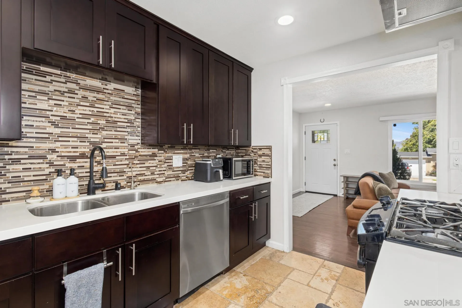 346 El Monte Road El Cajon, CA 92020 - Photo 7 of 24 a kitchen with a sink cabinets and window