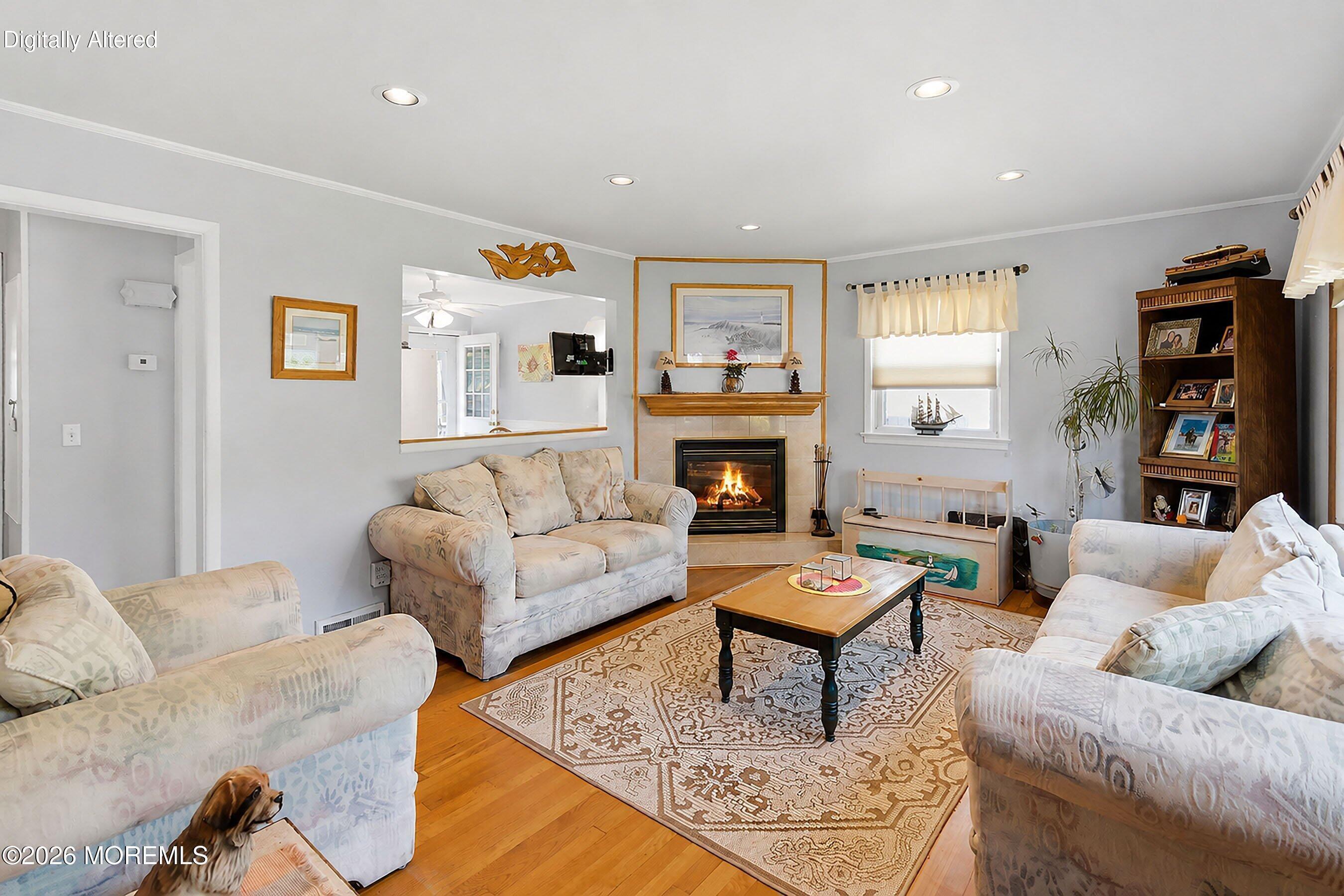 412 Moore Road Neptune Township, NJ 07753 - Photo 4 of 36 a living room with furniture and a fireplace