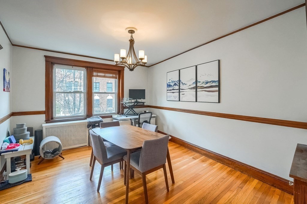 22 James Street, Unit 1 Brookline, MA 02446 - Photo 12 of 24 a view of a dining room with furniture window and wooden floor
