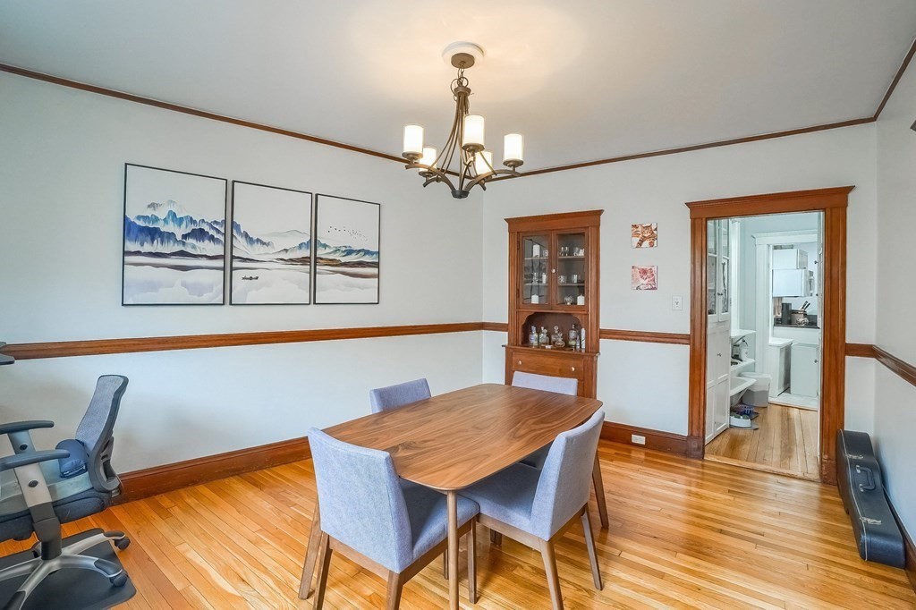 22 James Street, Unit 1 Brookline, MA 02446 - Photo 13 of 24 a view of a dining room with furniture and wooden floor