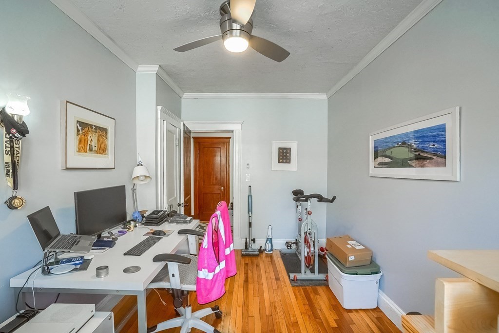 22 James Street, Unit 1 Brookline, MA 02446 - Photo 20 of 24 a workspace with furniture and wooden floor
