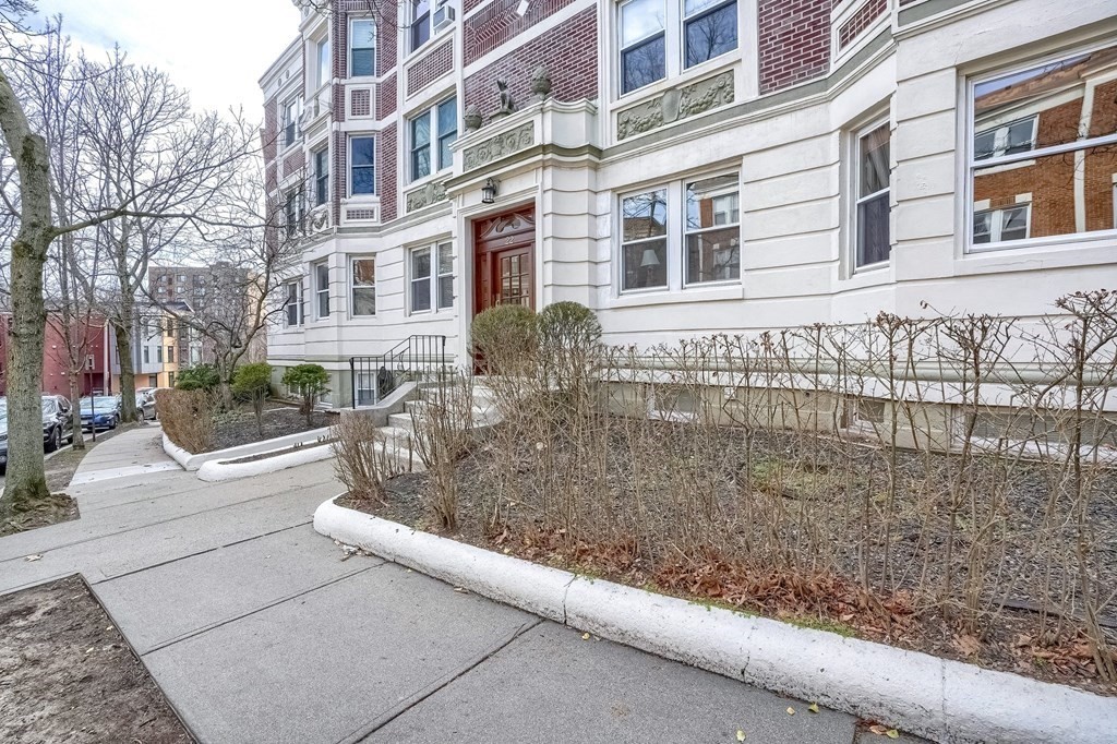 22 James Street, Unit 1 Brookline, MA 02446 - Photo 2 of 24 a view of a brick building with many windows