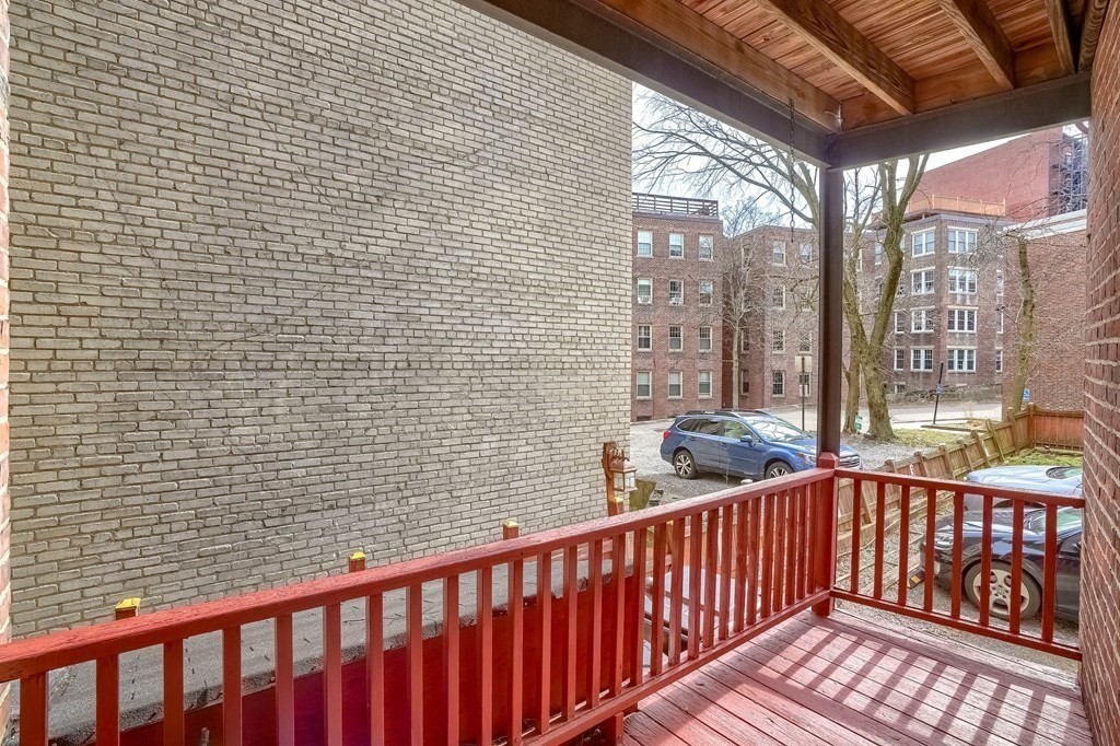 22 James Street, Unit 1 Brookline, MA 02446 - Photo 21 of 24 a view of a balcony with wooden floor