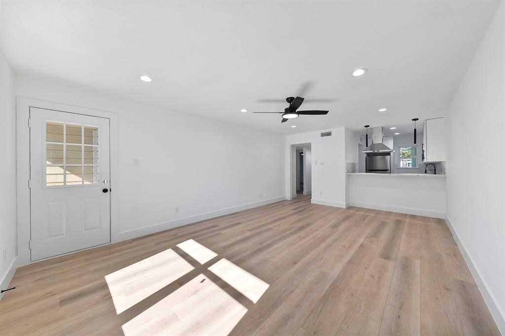 1514 Wirt Road, Unit 4 Houston, TX 77055 - Photo 11 of 20 a view of empty room with wooden floor and windows