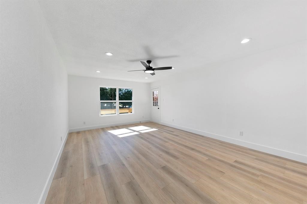 1514 Wirt Road, Unit 4 Houston, TX 77055 - Photo 15 of 20 wooden floor in an empty room with a window