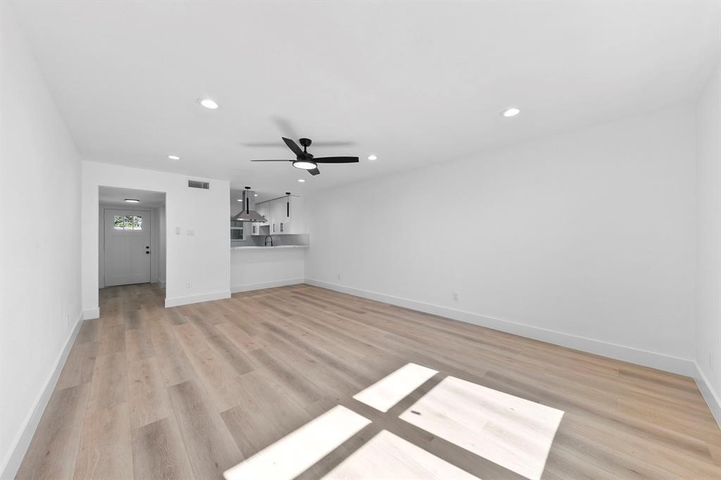 1514 Wirt Road, Unit 4 Houston, TX 77055 - Photo 10 of 20 wooden floor in an empty room with a window