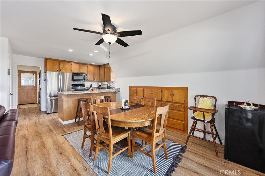 28207 Oaks Rancho Road Keene, CA 93531 - Photo 13 of 48 a view of a dining room with furniture and wooden floor