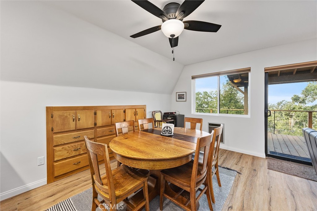 28207 Oaks Rancho Road Keene, CA 93531 - Photo 14 of 48 a view of a dining room with furniture window and wooden floor