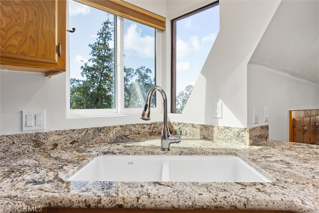 28207 Oaks Rancho Road Keene, CA 93531 - Photo 19 of 48 a view of a kitchen sink and a window