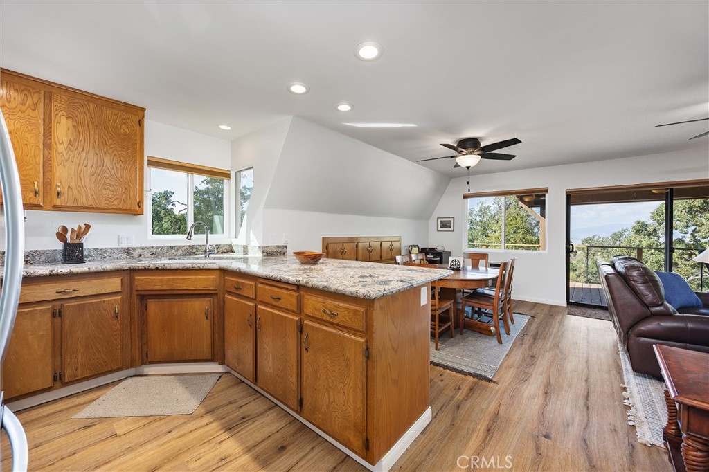 28207 Oaks Rancho Road Keene, CA 93531 - Photo 6 of 48 a open kitchen with stainless steel appliances granite countertop a stove and a sink
