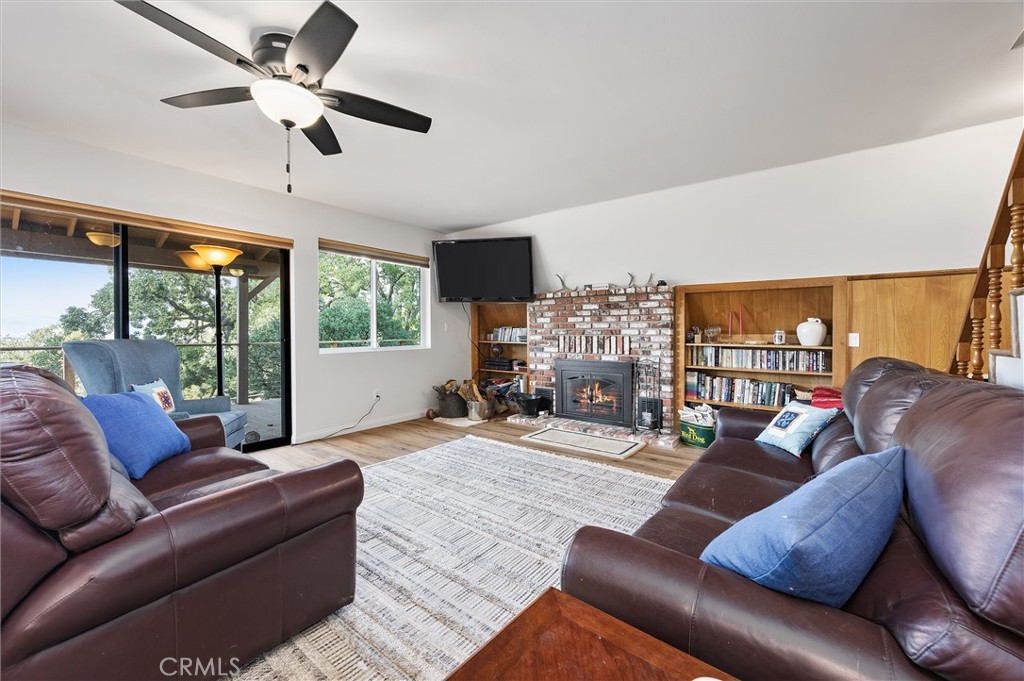 28207 Oaks Rancho Road Keene, CA 93531 - Photo 7 of 48 a living room with furniture ceiling fan and a large window