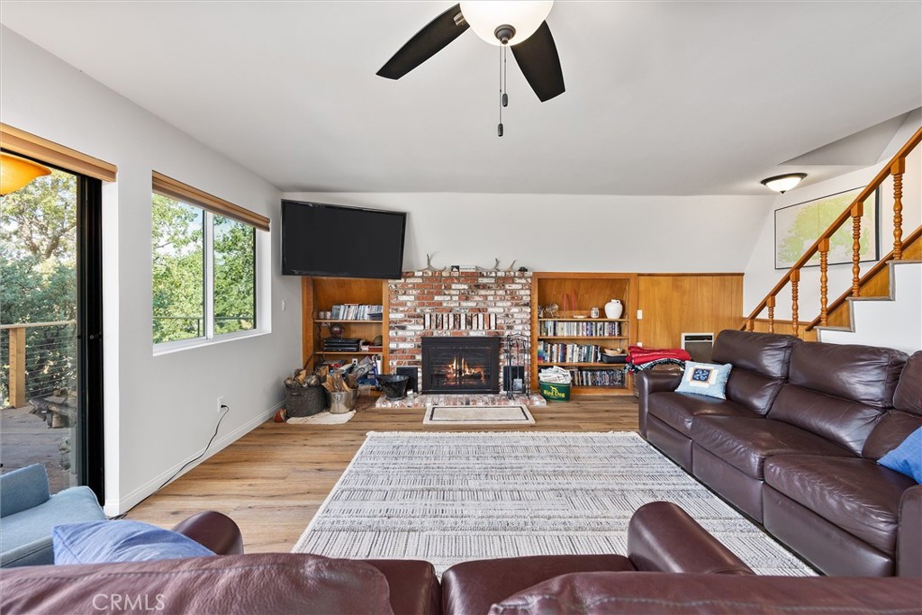 28207 Oaks Rancho Road Keene, CA 93531 - Photo 8 of 48 a living room with furniture and a fireplace