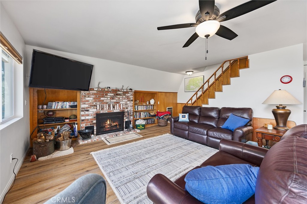 28207 Oaks Rancho Road Keene, CA 93531 - Photo 10 of 48 a living room with furniture and a fireplace