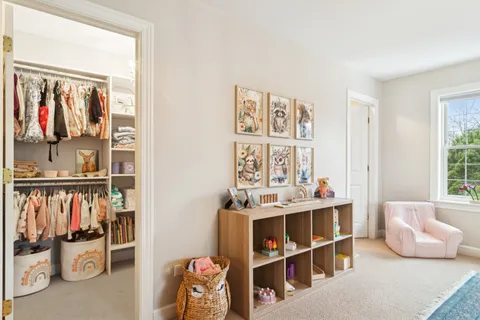 a view of a livingroom with furniture and toys