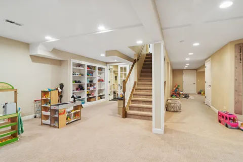 a room with stairs and furniture
