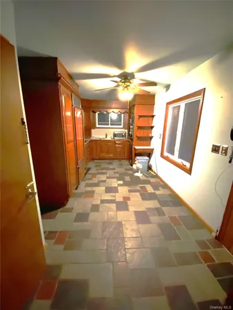 a view of an empty room with a fireplace
