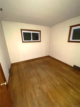 a view of a big room with wooden floor