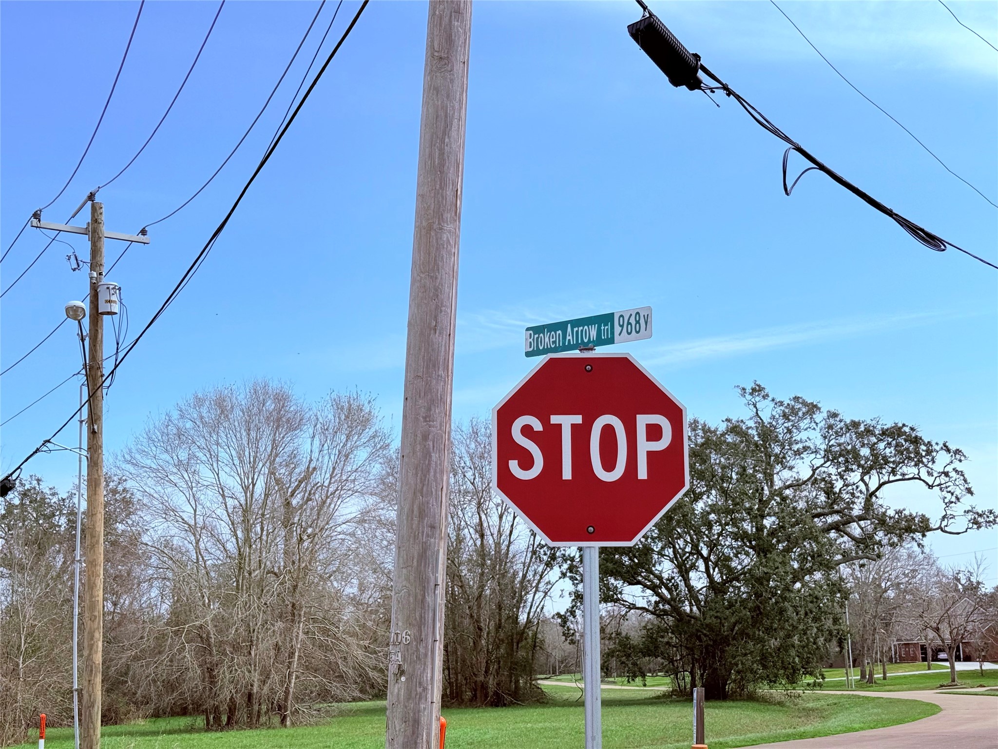 1370 Broken Arrow Trail Angleton, TX 77515 - Photo 13 of 13 a sign board with a play ground in the back