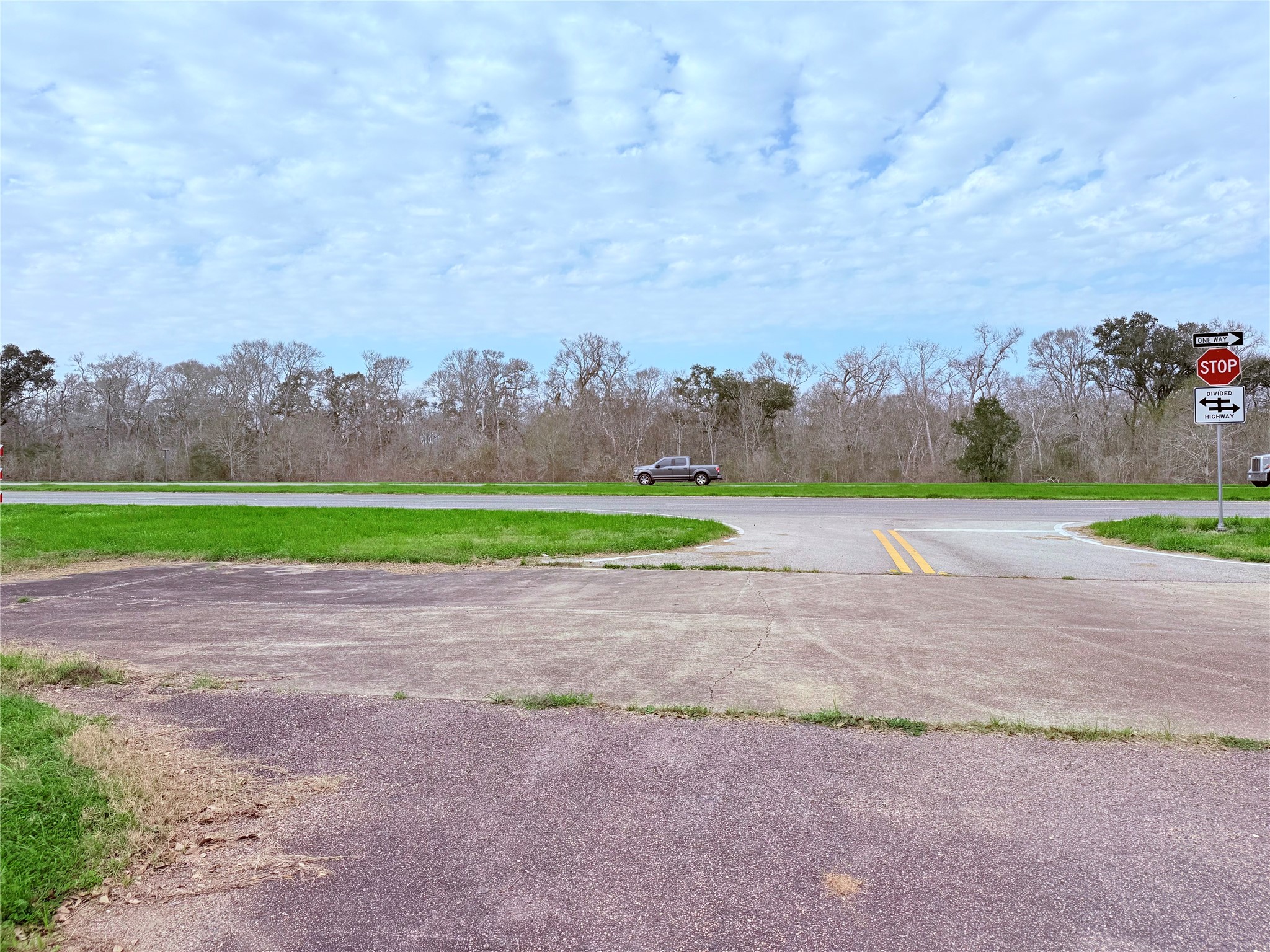 1370 Broken Arrow Trail Angleton, TX 77515 - Photo 2 of 13 a view of a yard with large trees