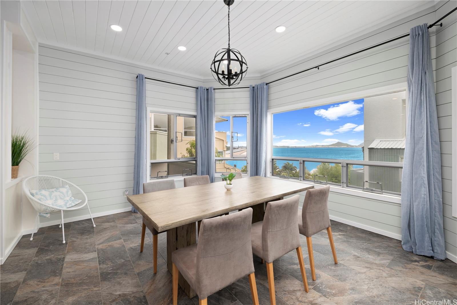 a view of a dining room with furniture window and outside view