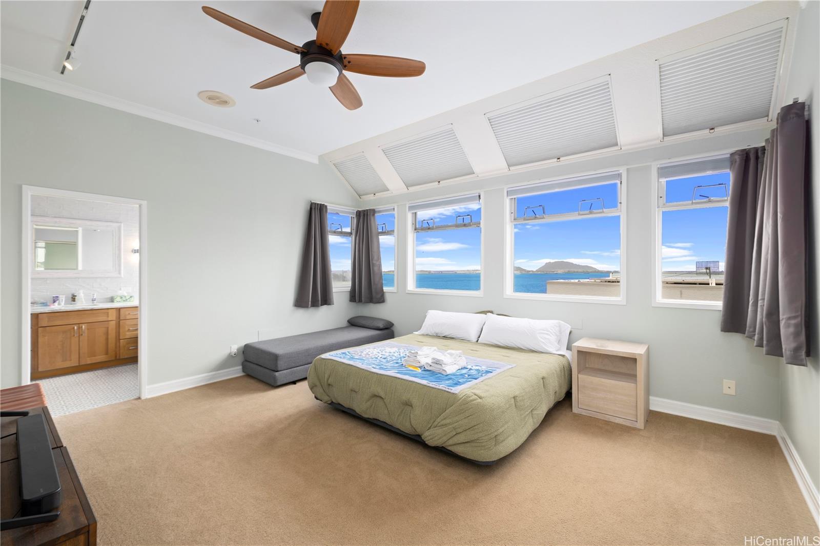 45-081 Lilipuna Road, Unit G Kaneohe, HI 96744 - Photo 14 of 25 a bedroom with a bed dresser and a window