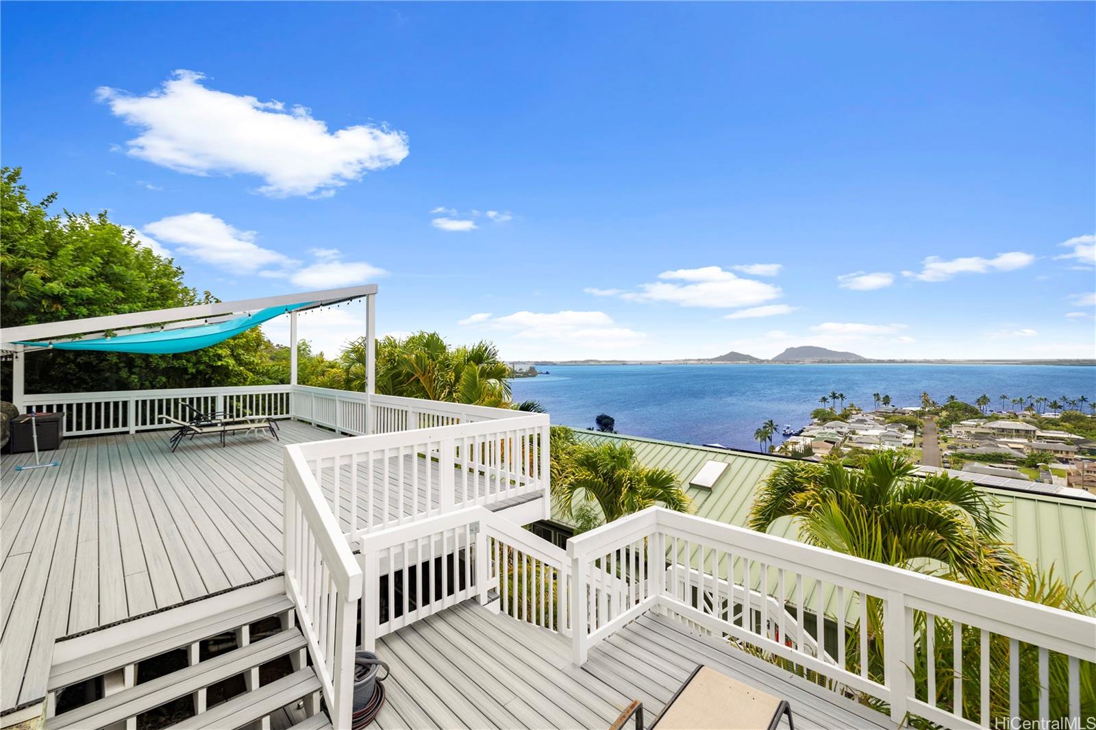 45-081 Lilipuna Road, Unit G Kaneohe, HI 96744 - Photo 19 of 25 a view of a roof deck with wooden floor and fence