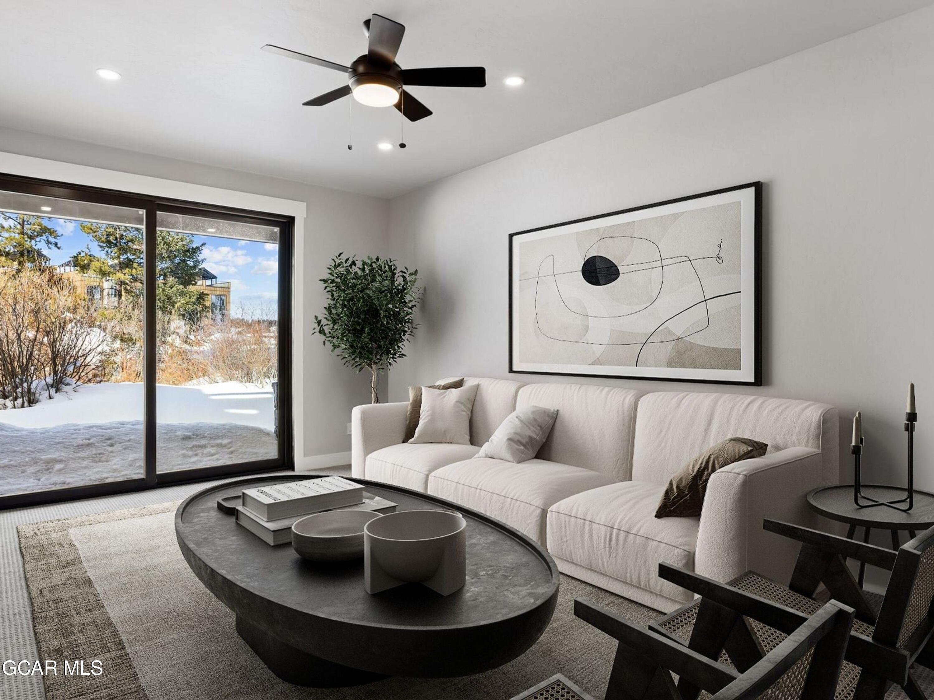 12 Exploration Trail Winter Park, CO 80482 - Photo 35 of 52 a living room with furniture and a floor to ceiling window