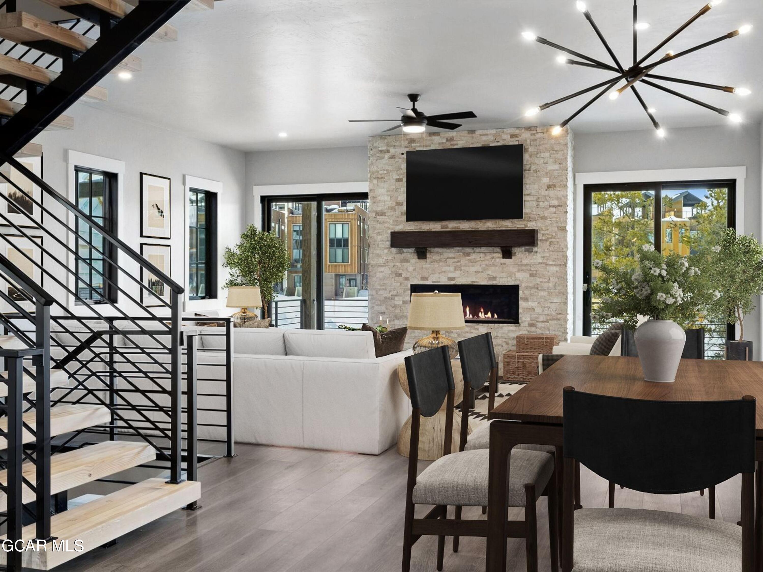 12 Exploration Trail Winter Park, CO 80482 - Photo 8 of 52 a living room with fireplace furniture and a flat screen tv