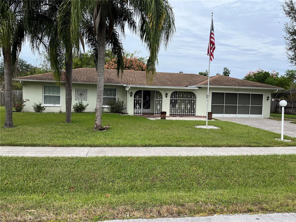 4059 Ligonier Road Spring Hill, FL 34608 - Photo 1 of 1 a front view of a house with a yard