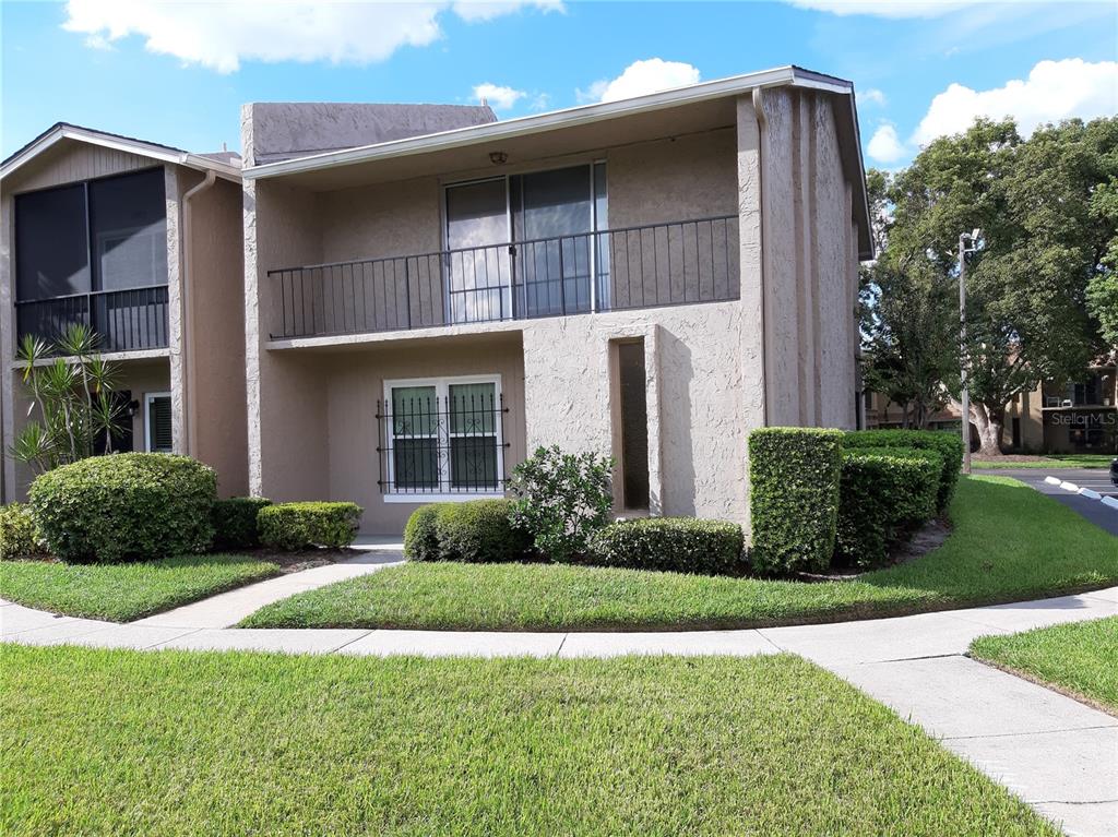 824 Town Circle, Unit 101 Maitland, FL 32751 - Photo 1 of 28 a front view of a house with garden