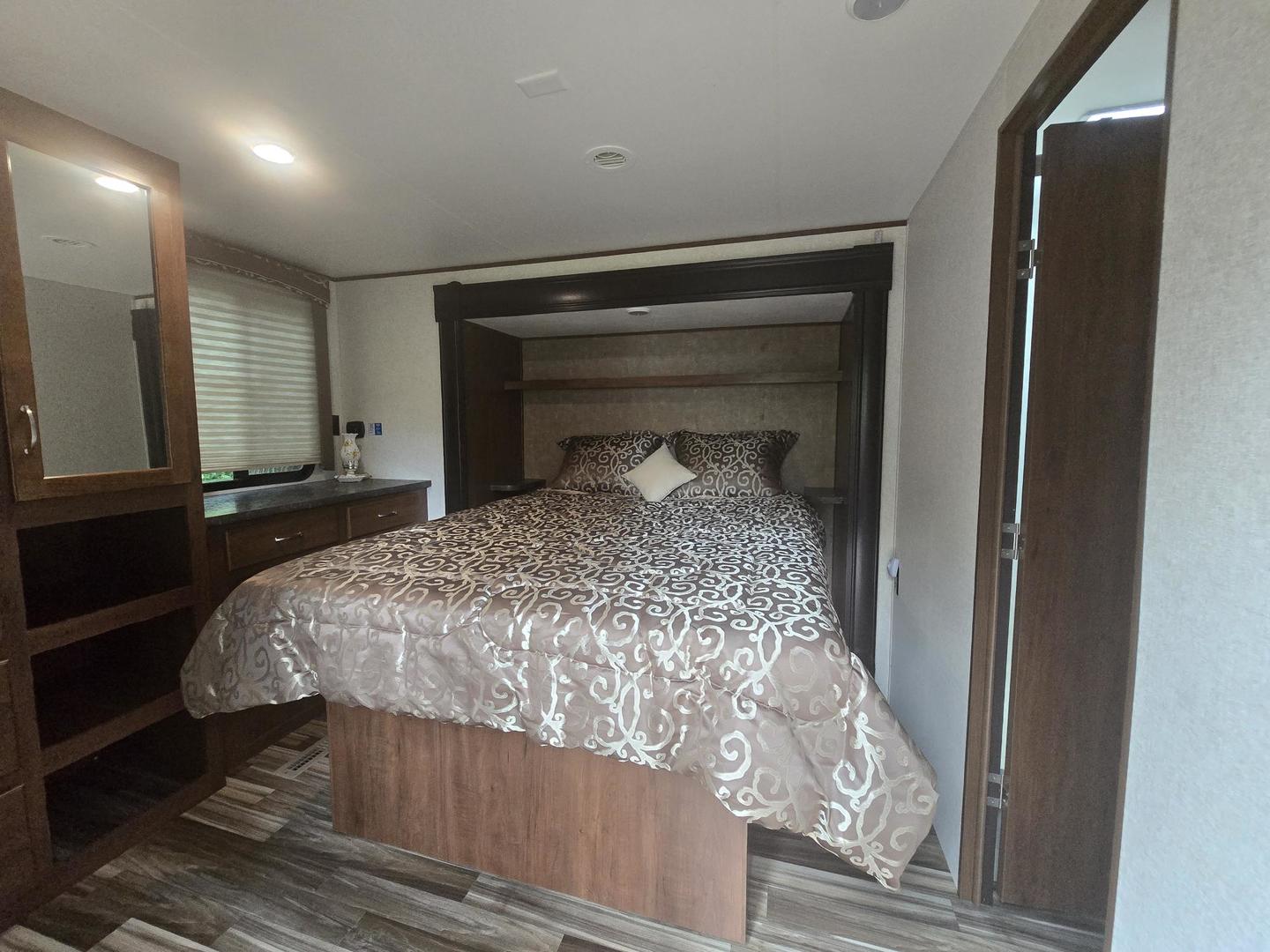 5-343 & 344 Woodhaven Sublette, IL 61367 - Photo 11 of 27 a bedroom with a bed and a mirror