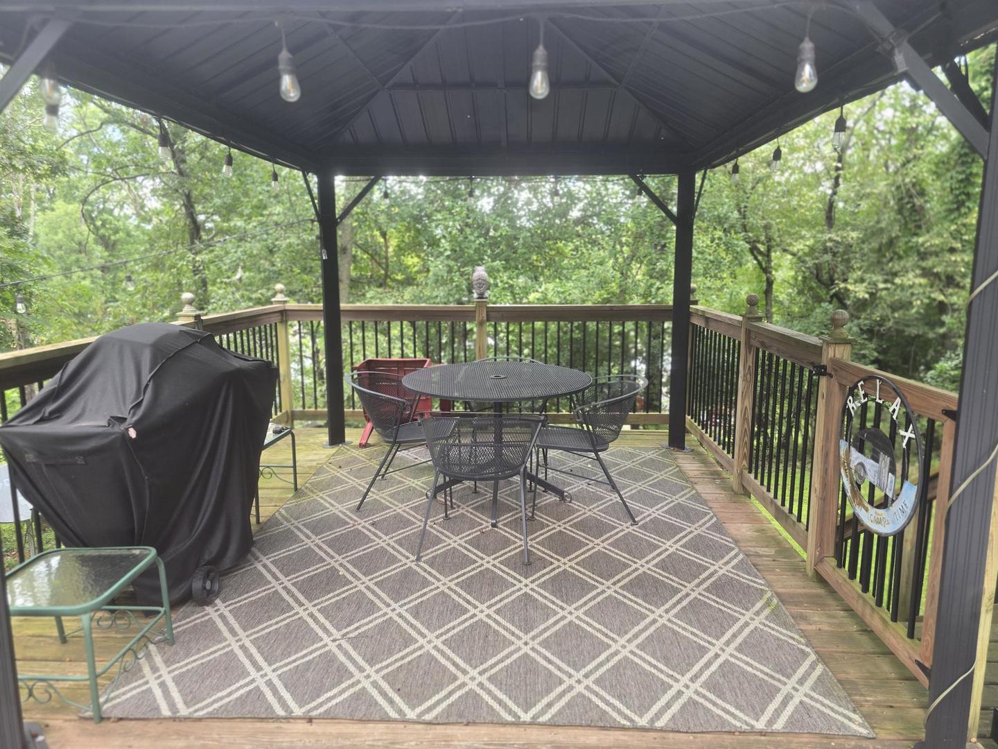 5-343 & 344 Woodhaven Sublette, IL 61367 - Photo 2 of 27 a view of a patio with table and chairs with wooden floor and fence