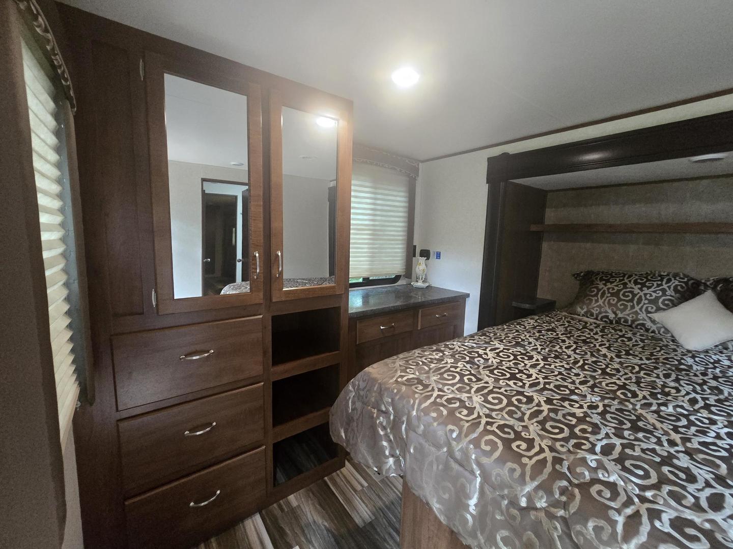 5-343 & 344 Woodhaven Sublette, IL 61367 - Photo 23 of 27 a bedroom with a bed and a dresser