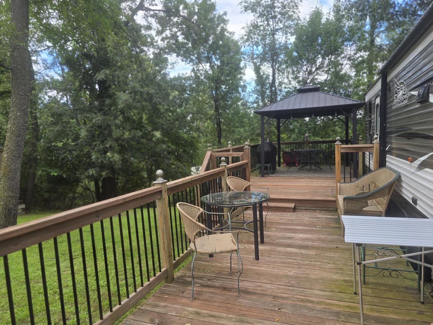 5-343 & 344 Woodhaven Sublette, IL 61367 - Photo 4 of 27 a view of a chairs and tables in the balcony