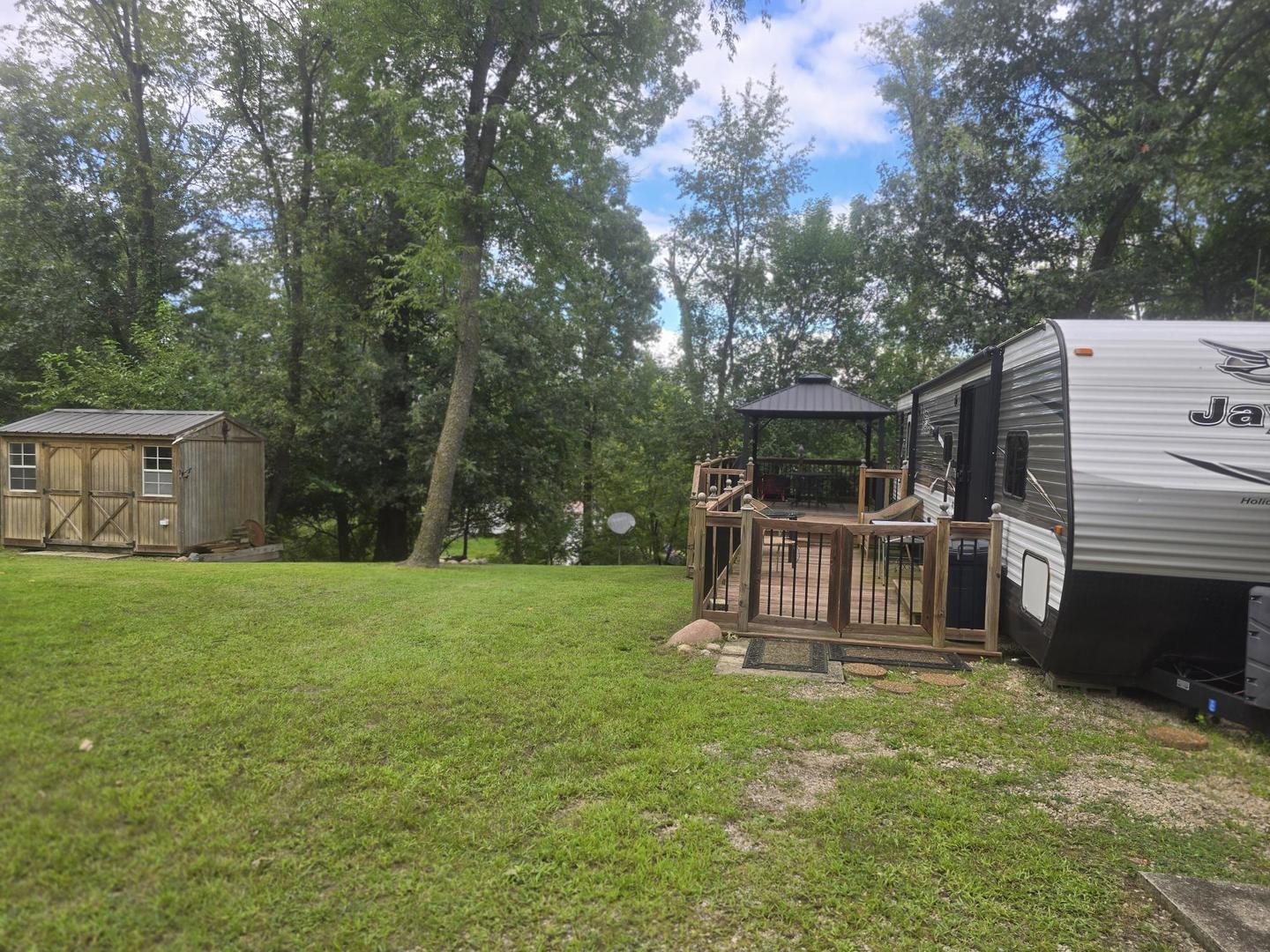 5-343 & 344 Woodhaven Sublette, IL 61367 - Photo 8 of 27 a view of backyard with deck and a garden