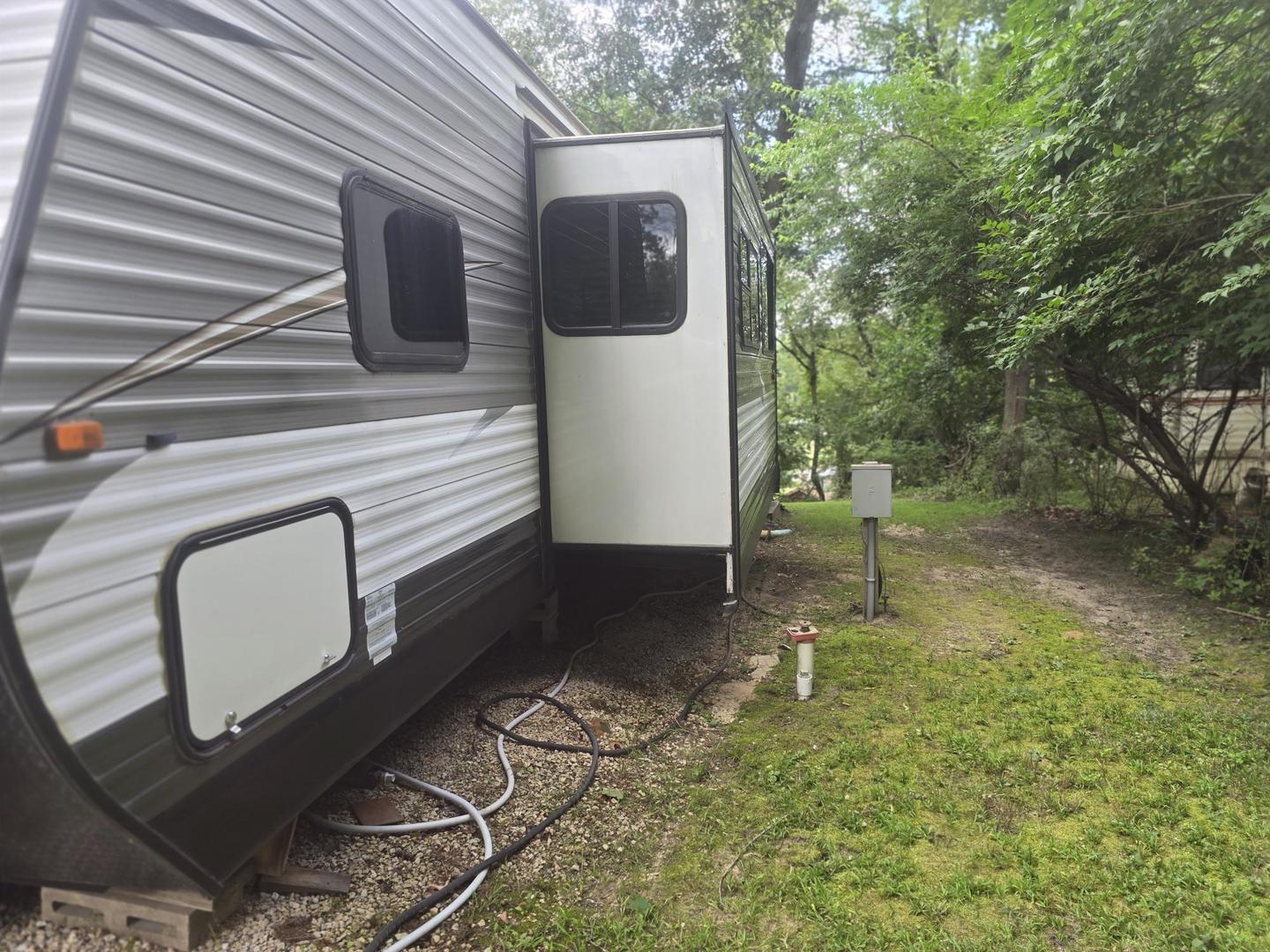 5-343 & 344 Woodhaven Sublette, IL 61367 - Photo 9 of 27 a backyard of a house with lots of green space