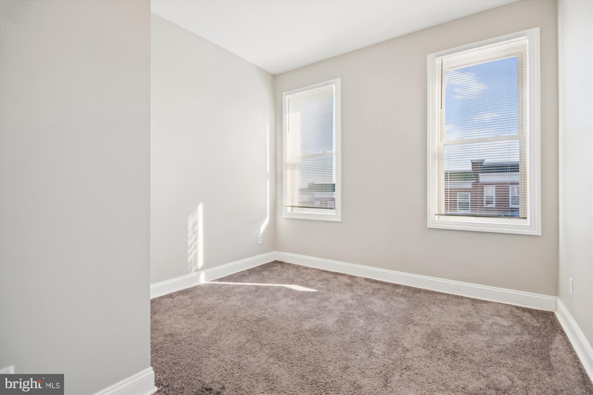 730 Edgewood Street Baltimore, MD 21229 - Photo 12 of 21 an empty room with windows