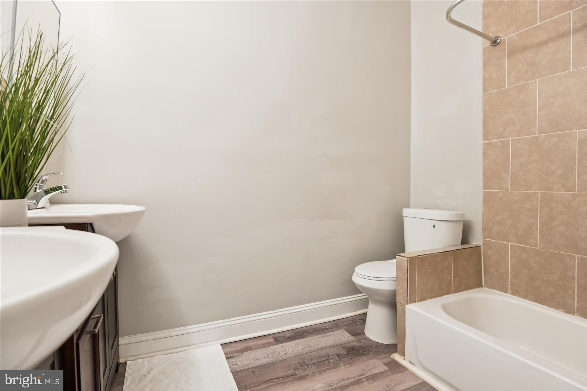 730 Edgewood Street Baltimore, MD 21229 - Photo 17 of 21 a bathroom with a sink and a toilet