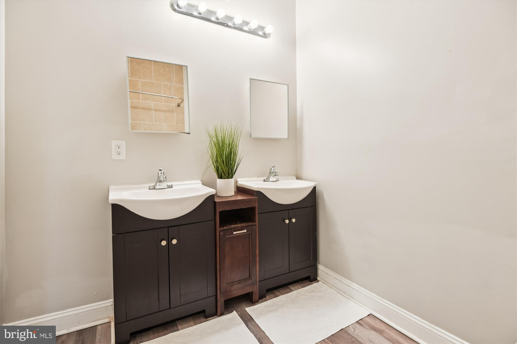 730 Edgewood Street Baltimore, MD 21229 - Photo 18 of 21 a bathroom with a sink and a mirror