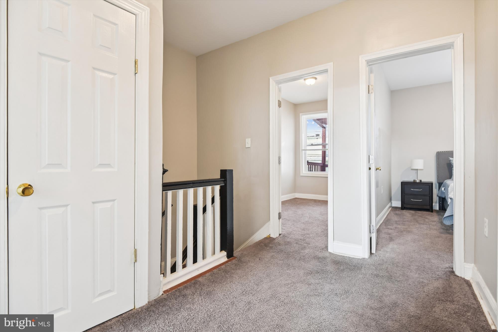 730 Edgewood Street Baltimore, MD 21229 - Photo 19 of 21 a view of a hallway with three rooms