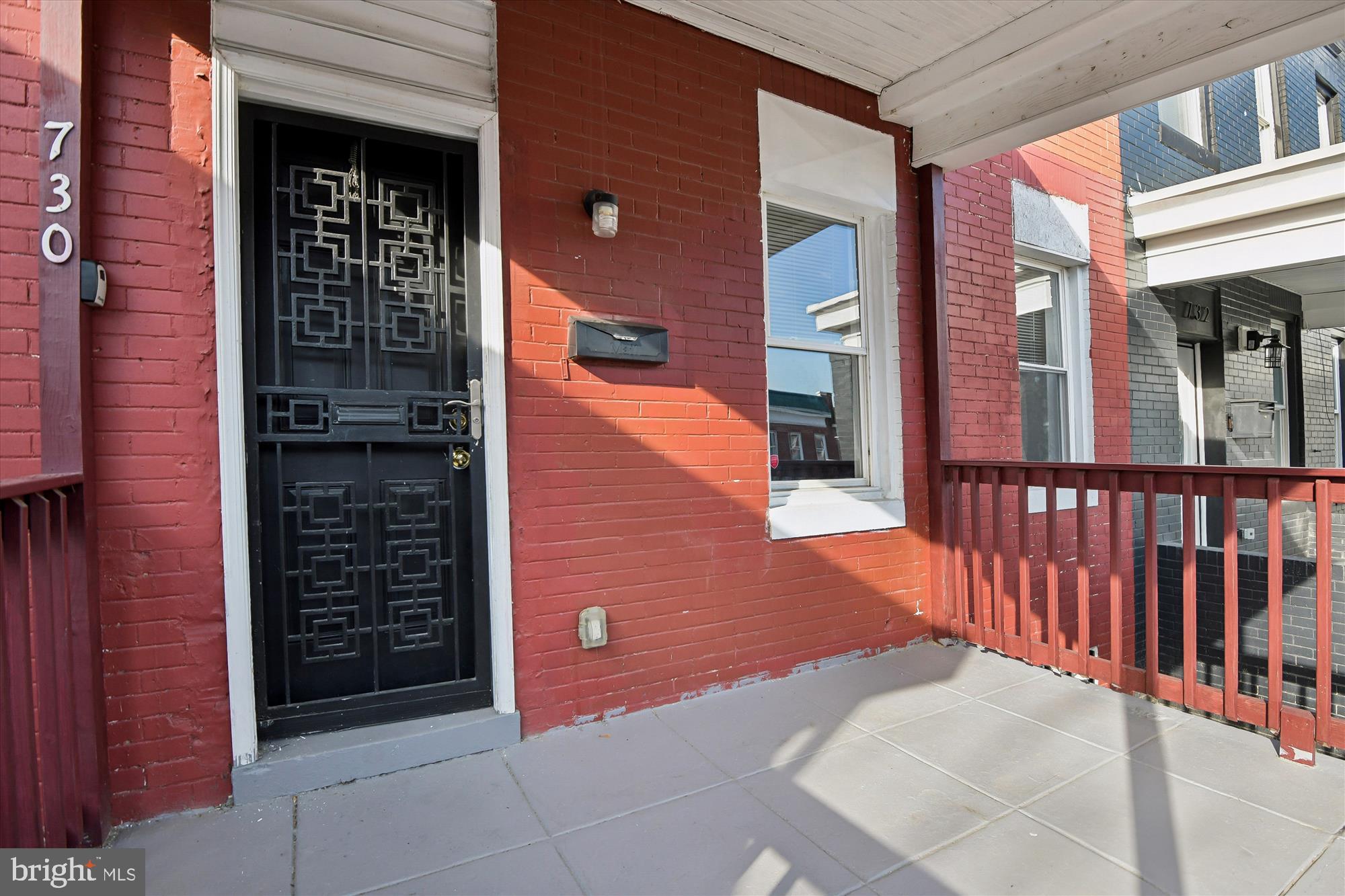730 Edgewood Street Baltimore, MD 21229 - Photo 4 of 21 a view of a brick house with a large window