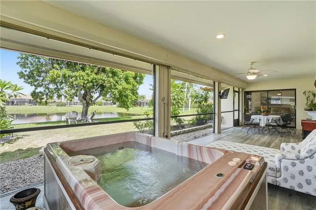 a room with furniture and a large window