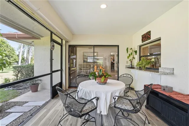 a view of a dining room with furniture window and outside view